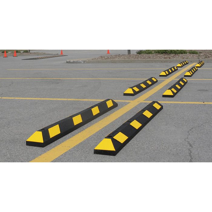 Park It Black and Yellow Parking Blocks In Use Outside Parking Lot Image